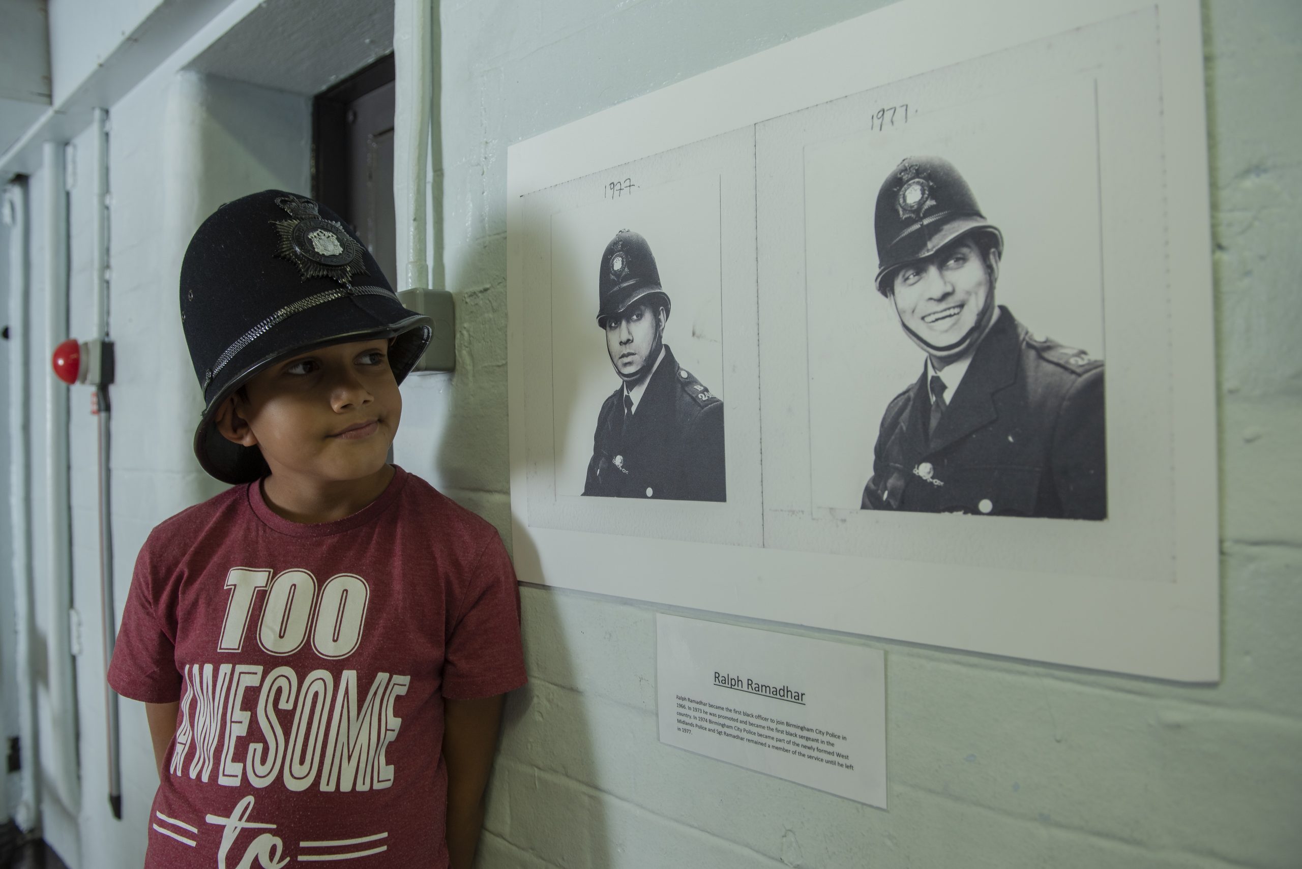Family of former officer Ralph Ramadhar visit the lock up where a photo of him is on display. Ralph was the first black officer in Birmingham police.